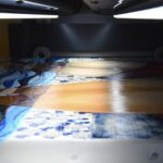 Support en cours de numérisation sur le scanner sans contact StudioScan